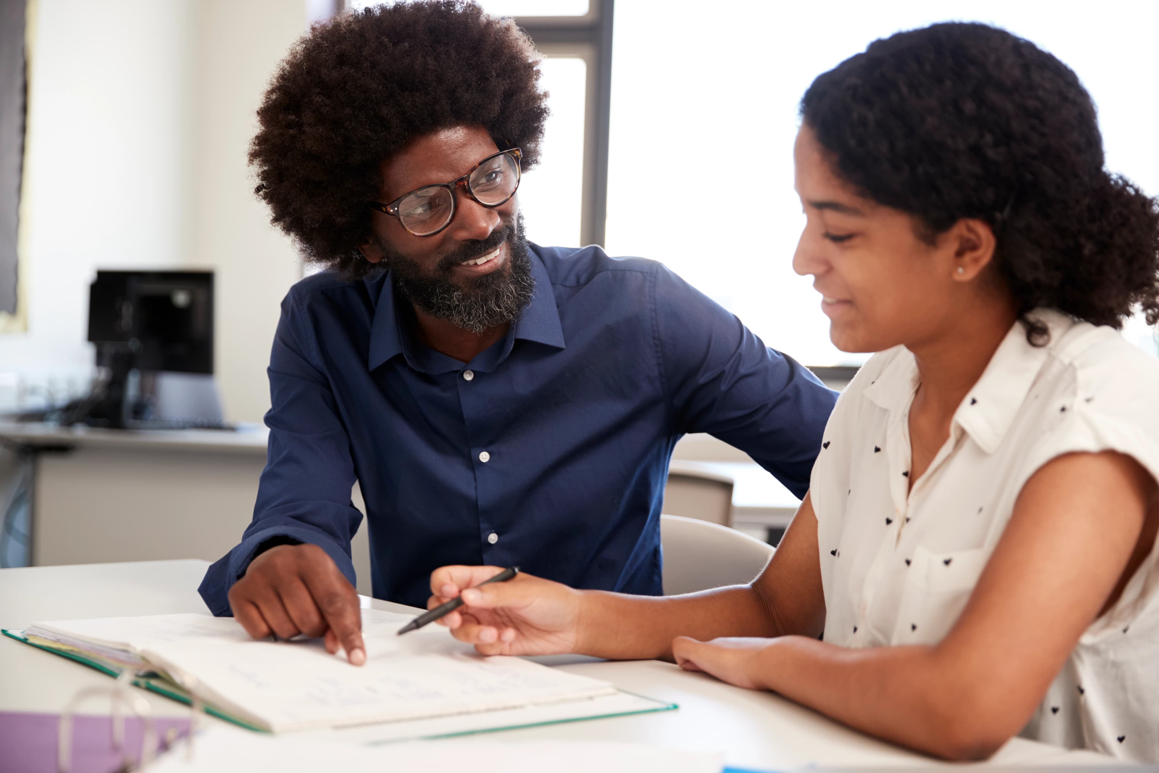 Mentor guiding a student