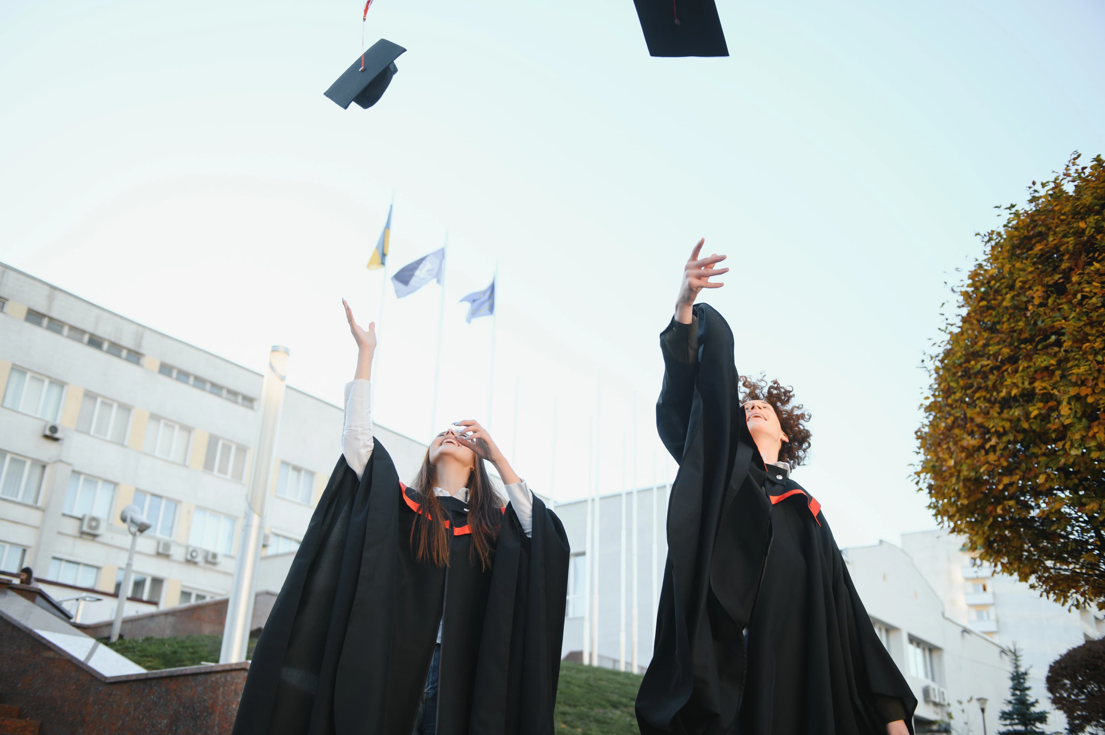 Joyful graduation cap toss